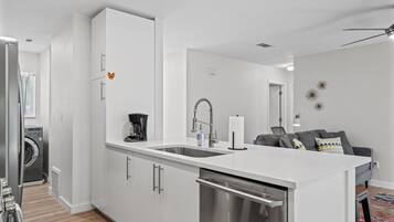Coffee bar, dishwasher, and full pantry storage make morning routines and cleanup simple.