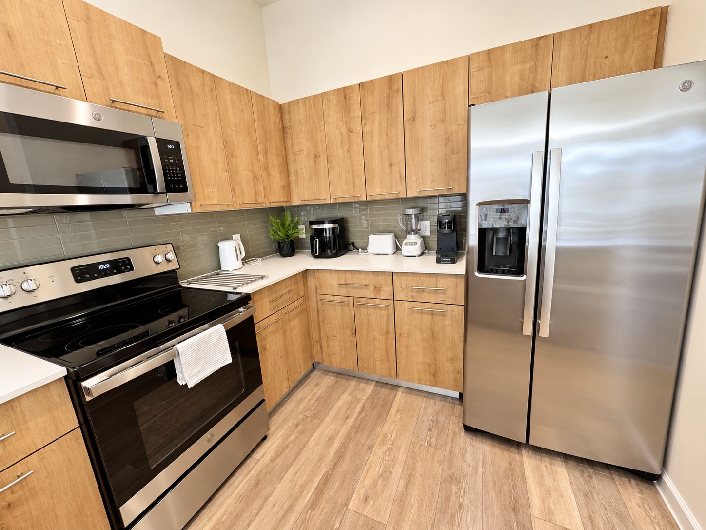Modern full kitchen with stainless appliances and ample cabinet space