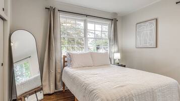 Bedroom with standing mirror