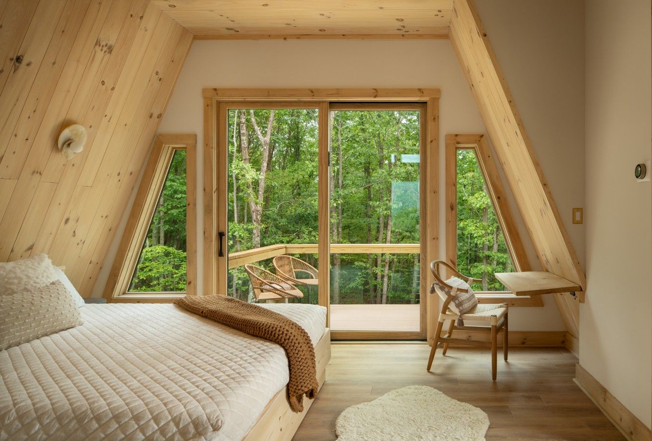 Wake up immersed in the trees, with a serene private bedroom that brings the Shenandoah landscape right to your bedside