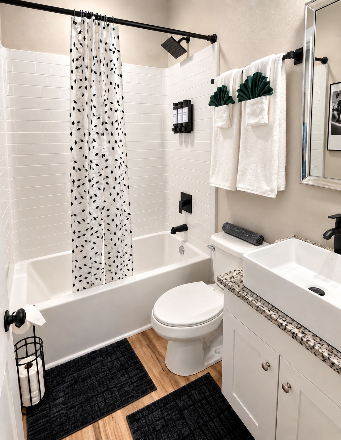 A bathroom with a bathtub, toilet, sink, and a shower curtain.