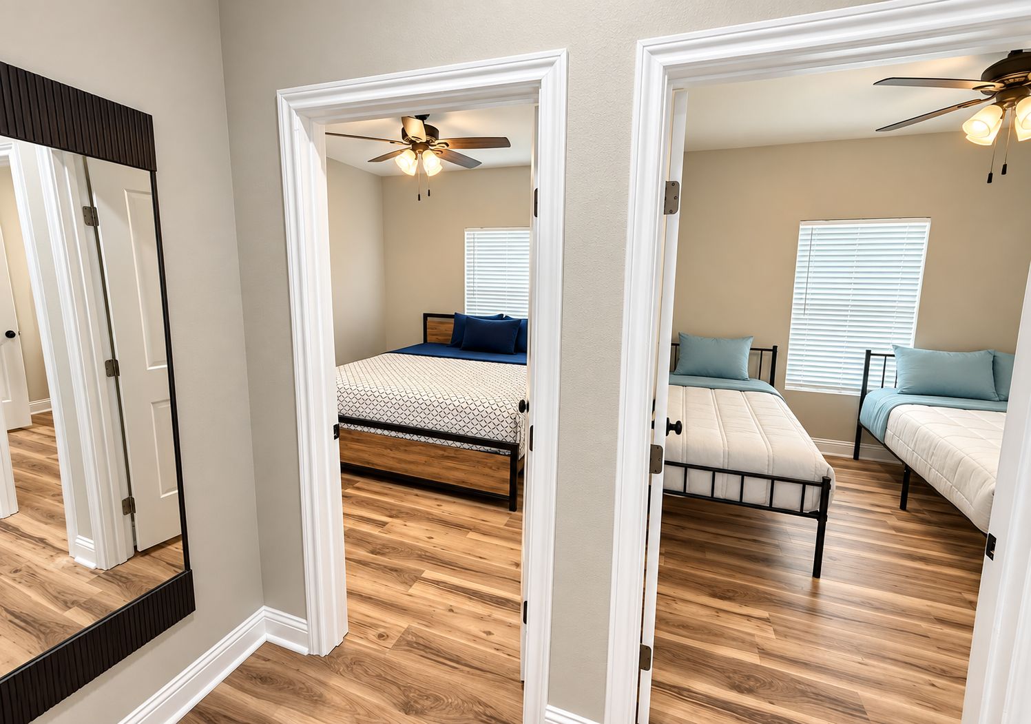 A bedroom with a bed, a ceiling fan, and a window with blinds.