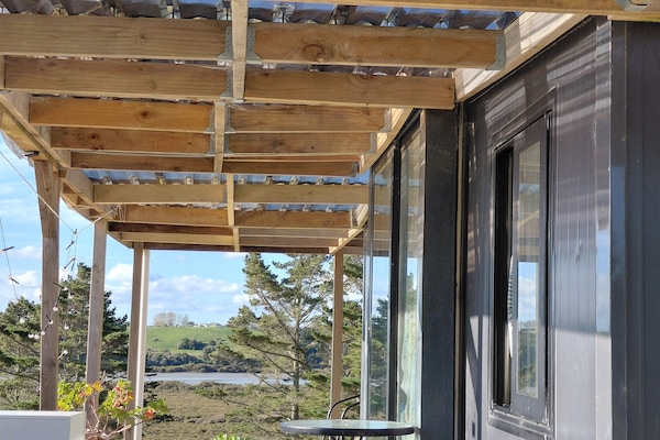 Front of wraparound deck with views of the expansive Kaipara estuary.