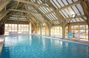 An indoor swimming pool with a high wooden ceiling and large windows. - Sybelles Ski Area | Sleeps 7 | Slope-side Comfort (Saint Sorlin d'Arves)