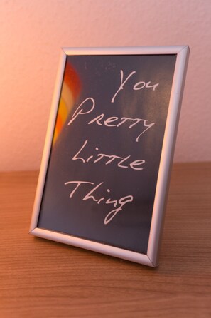 A framed sign with the text 'You Pretty Little Thing' on a dark background. - Apartments Lovro - Duplex One Bedroom Apartment With Terrace and Partial Sea View (Dubrovnik)