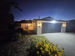 A residential house with a garage, a front door, and a driveway.
