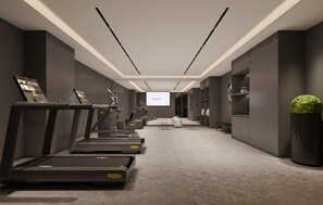 A modern gym with treadmills, a large screen, and a minimalist design. - Intercity Hotel Shanghai Xinzhuang Biz (Shanghai)