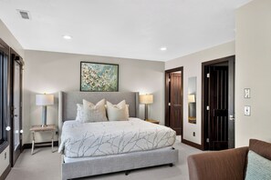Bedroom 4 features a king bed, TV, and ensuite bathroom for a restful stay. - Hot Tub + Cedar Sauna + Game Room | Walk to Main St | Alpine Ridge Lodge (Park City)