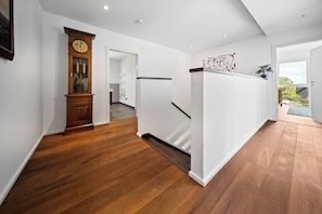 A modern kitchen with a white refrigerator, wooden flooring, and a view of the outdoors through a window. - 25 Min to Munich Luxury 370 m² 4,000 sqft Villa Aircon + Heat Pump (Eching)