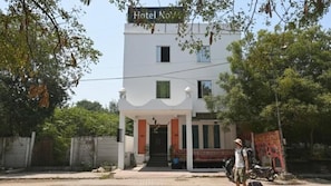 A two-story building with a sign that reads 'Hotel Nav.' - Hotel NoVo Agra (Agra)
