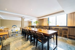 A conference room with a long table, chairs, and a large window with curtains. - Weiting Hotel Shanghai Stadium Xujiahui (Shanghai)