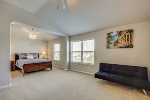 A bedroom with a bed, a bench, and a painting on the wall. - Hot Tub & Patio! Family Escape, 7 Mi to SeaWorld (San Antonio)