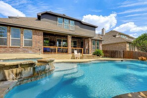 A residential property with a swimming pool, a covered patio, and a brick exterior. - Home Theater & Game Room! 7BR San Antonio Retreat (San Antonio)