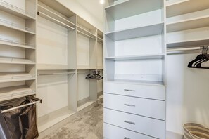 A walk-in closet with open shelving, drawers, and hanging space. - Peaceful & Modern Gem w/ Private Pool in Henderson (Henderson)