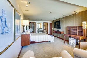 A hotel room with a bed, bedside table, lamp, TV, and a seating area with chairs. - Beach + Poolside Days! Extended Coronado Escape (Coronado)