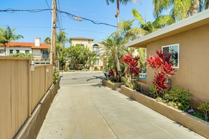 A residential street with houses, palm trees, and a clear sky. - Walk to Beach & Dtwn! Extended San Clemente Escape (San Clemente)