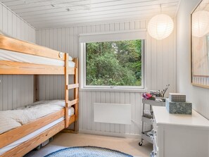 A bunk bed room with a window, a desk, and a radiator. - "Waghn" -  from the sea by Interhome (Hadsund)