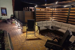 An outdoor patio with a sofa, chairs, and a table. - Holiday apartment with 2 bedrooms (Oberwiesenthal)