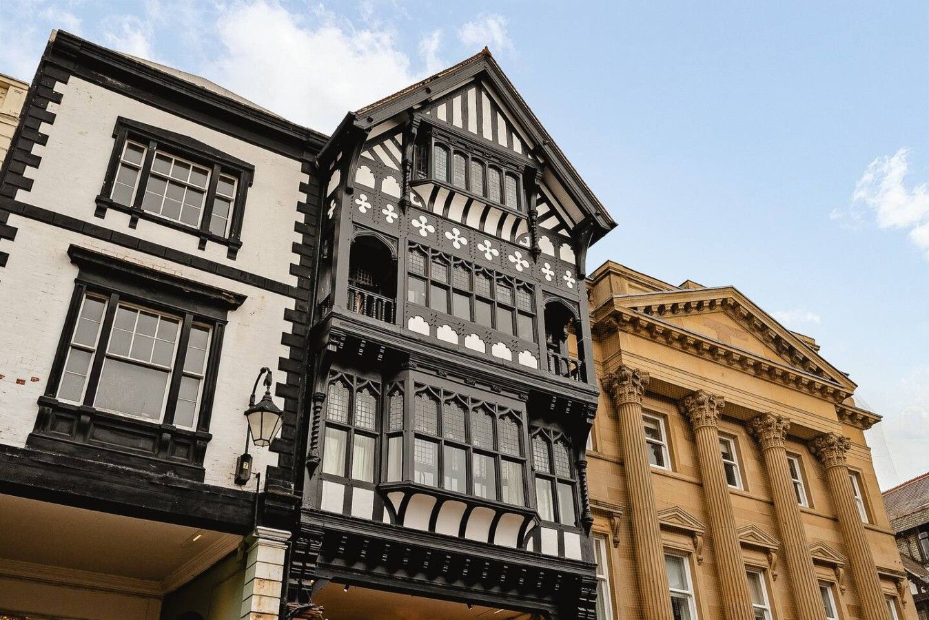 A building with a prominent black and white facade, large windows, and classical architectural elements.