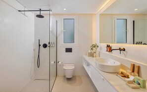 A modern bathroom with a glass-enclosed shower, a toilet, a large sink, and a mirror above the sink. - LiBa (Chlorakas)