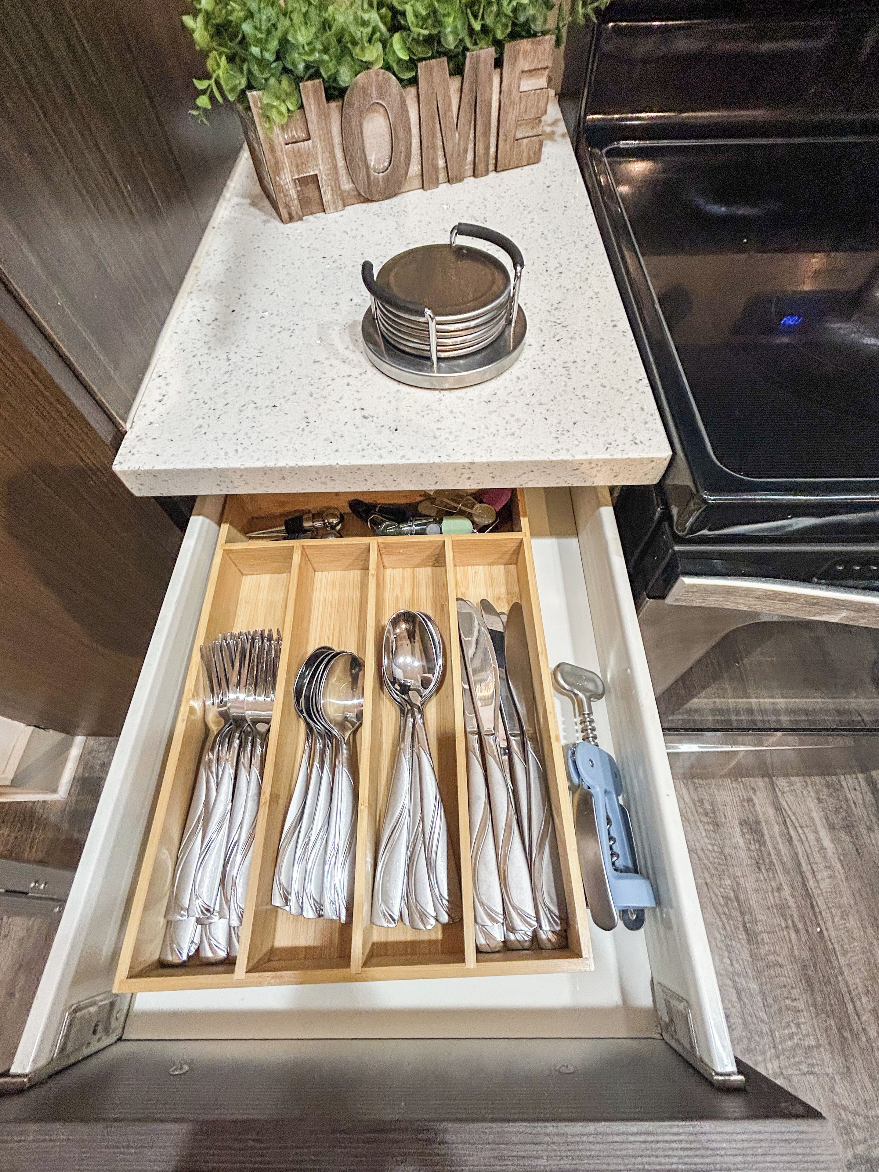 A kitchen drawer with utensils neatly organized.