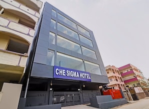 A hotel with a prominent sign reading 'CHE SIGMA HOTEL' above the entrance. - Townhouse Che Sigma (Hyderabad)