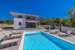 A modern two-story house with a swimming pool and outdoor seating. - Villa Adria Moments With Private Pool (Krk)