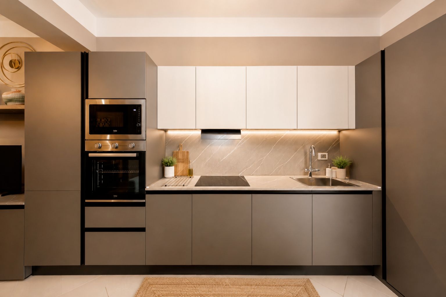A modern kitchen with built-in appliances, a central island, and a minimalist design.