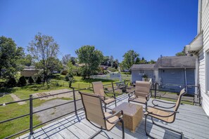 A deck with outdoor furniture, a view of a residential neighborhood, and a clear blue sky. - Couple's Welcome! Cozy Beckley Escape w/ Deck (Beckley)