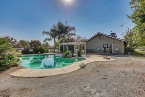 A house with a swimming pool, patio furniture, and a pergola. - Private Pool! Charming Clovis Escape (Clovis)