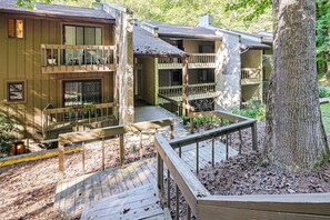 A multi-story building with balconies, wooden railings, and a deck area. - Hilltop Hideaway in Sapphire Near Lake Glenville (Cashiers)