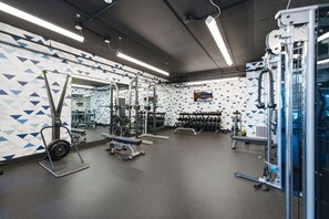 A gym with various exercise equipment, including weight machines, free weights, and cardio machines. - Pioche Basecamp | Deer Valley + Mountain Views (Park City)