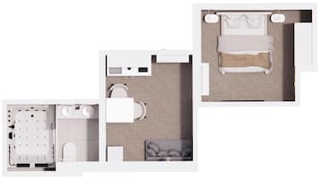 Una habitación de hotel con cama, baño y zona de estar.