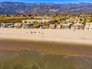 A coastal town with beachfront properties, a sandy beach, and mountains in the background. - 25% Off Oct 29-31 Walk 2 Beach/Shops -Pool,Jacuzzi (Ventura)