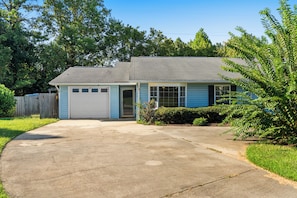 A single-story house with a garage, a front yard, and a driveway. - 3-bedroom duplex with 2 living rooms, close to Tiger Town and I85 (Opelika)
