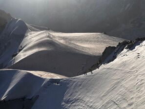 A snow-covered mountain landscape with a valley. - NEW! Apartment Alpage | Large Terrace (Les Houches)