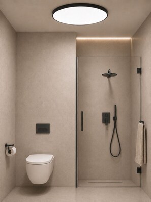 Un baño moderno con inodoro, cabina de ducha y barra para toallas.