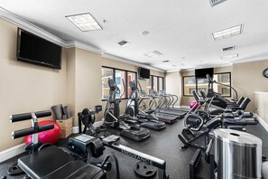 A fitness center with treadmills, elliptical machines, and weight equipment. - 🌊 2 Balconies | Gulf & Crab Island Views | 3BR Emerald Grande W1129 ☀️ (Destin)