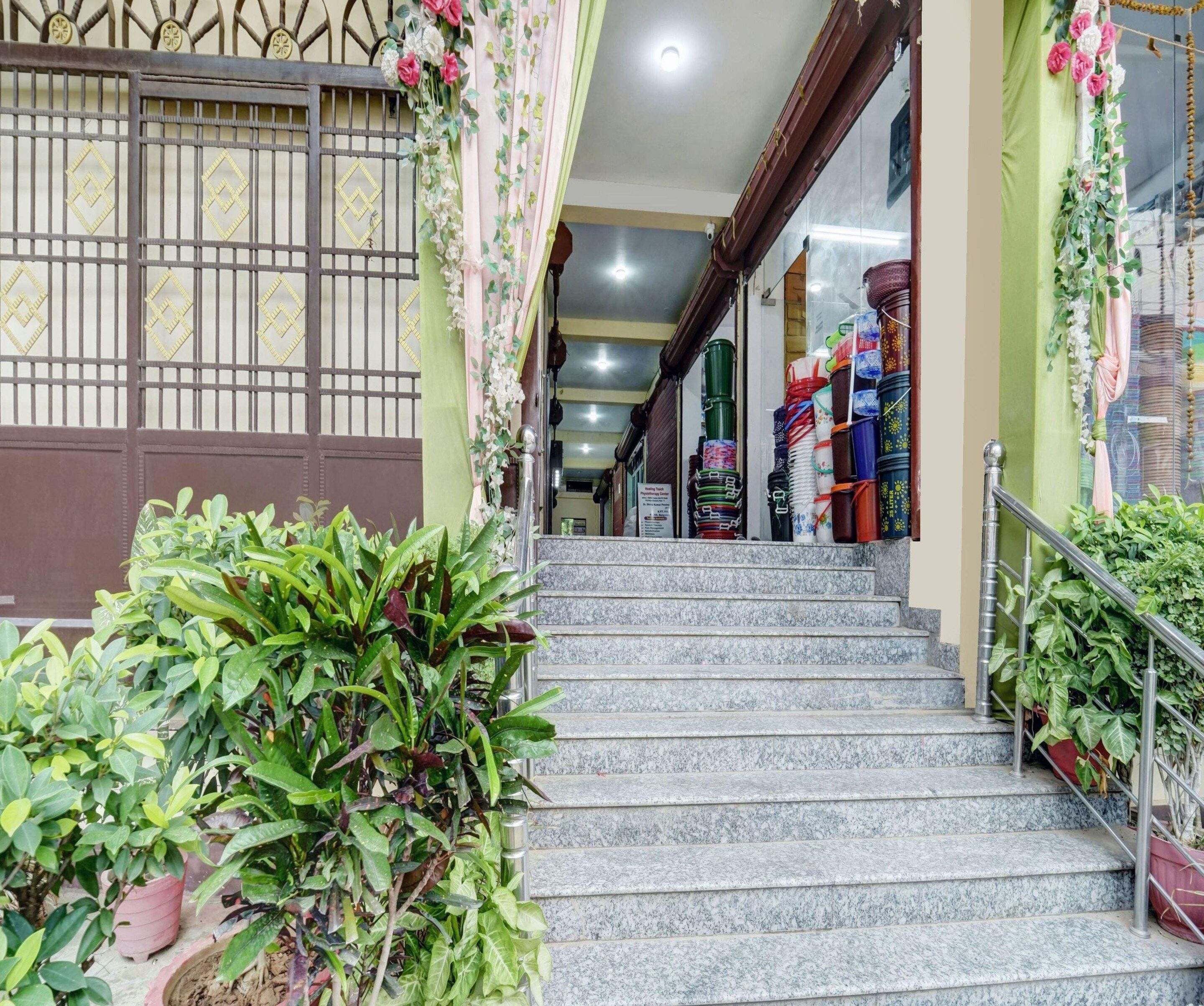 A staircase leading to a shop with colorful items displayed.