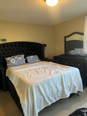 A bedroom with a bed, a dresser, and a mirror. - 🌿 JAVA HOUSE | Private Stay, No Sharing • Free Coffee, Breakfast & Parking (Edmonton)