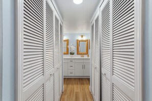 Primary hallway and bathroom - Seaside Veranda 🌊 Across from Beach w/ 3 Pools + Tennis Courts | Pet Friendly (New Smyrna Beach)
