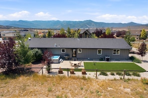 A residential house with a swimming pool, a patio, and a view of mountains. - The Perfect Pace - Park City Vacations (Park City)