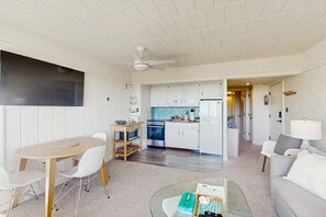 A compact living space with a dining area, kitchenette, and a separate seating area. - Cozy Retreat on Sleeping Bear Dunes & Lake Michigan Views (Glen Arbor)