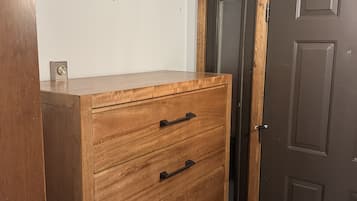 Welcoming entryway with wood storage cabinet and easy-care tile flooring