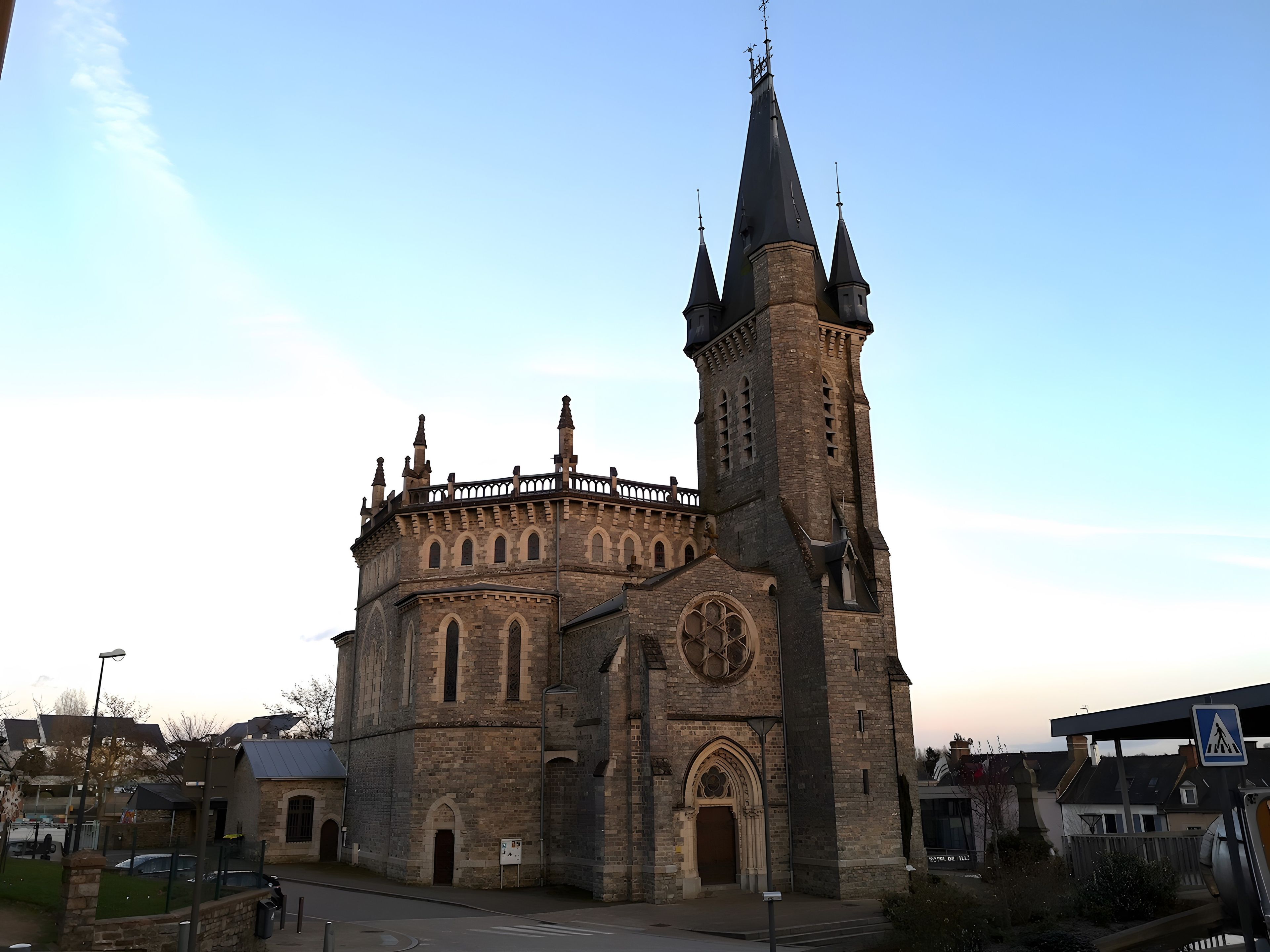 A historic church with a prominent tower and arched windows.