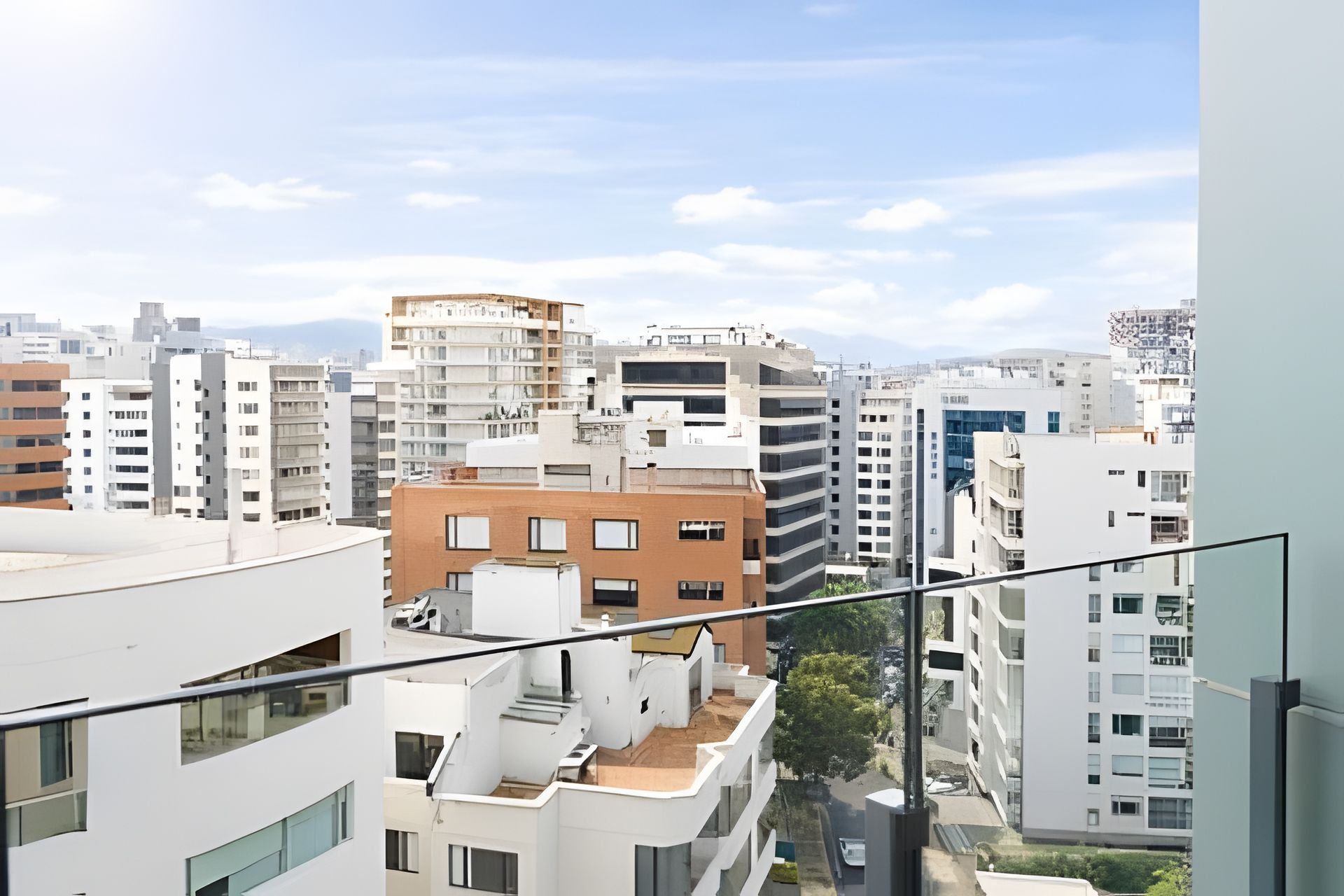 A high-rise urban residential area with multiple apartment buildings, some with balconies.