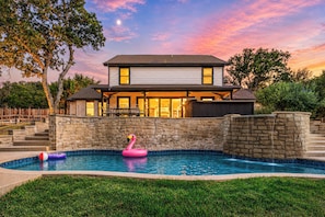 A two-story house with a swimming pool, stone walls, and a patio area. - The Castle Creek Ranch - 5-Acre Ranch, Private Pool, Game Room & Country Getaway (Cross Roads)