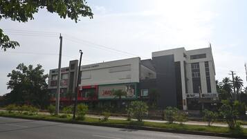 A multi-story building with a KFC restaurant, a cinema, and a hotel.