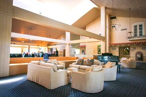 A spacious lobby with a high ceiling, a grand piano, and comfortable seating areas. - ***Fully remodeled from top to bottom ***It's time to get Away!!! (Palm Desert)