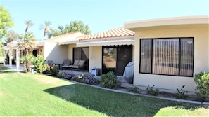 A modern two-story house with a patio, outdoor seating, and a covered grill area. - ***Enjoy The Gorgeous View From The Back Patio*** (Palm Desert)